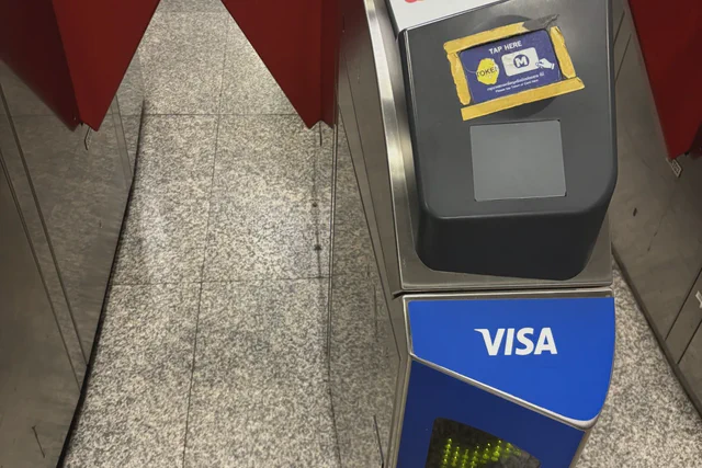 Contactless bank-card reader on a Bangkok MRT fare gate