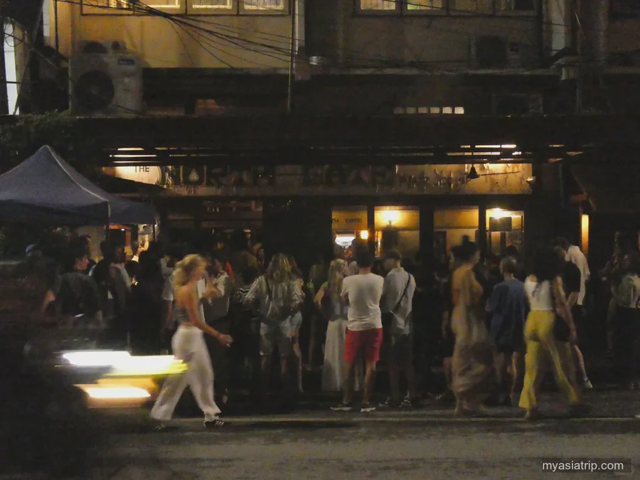 People gathering at a busy Chiang Mai night market