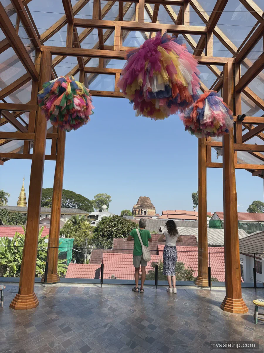 Historic brick gate and shaded public space in Chiang Mai's Old City
