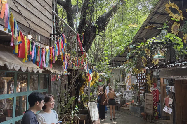 Shaded pedestrian lane with shops at One Nimman in Chiang Mai