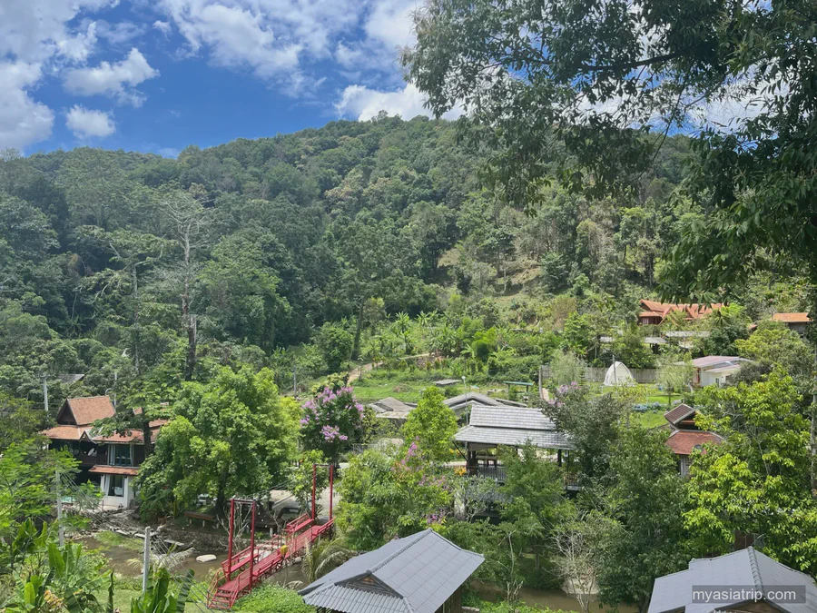 Green northern Thai hills surrounding a village near Chiang Mai
