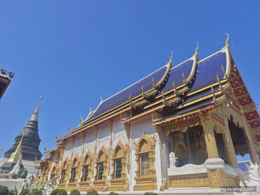 Golden roof and white facade of Wat Phra Singh in Chiang Mai