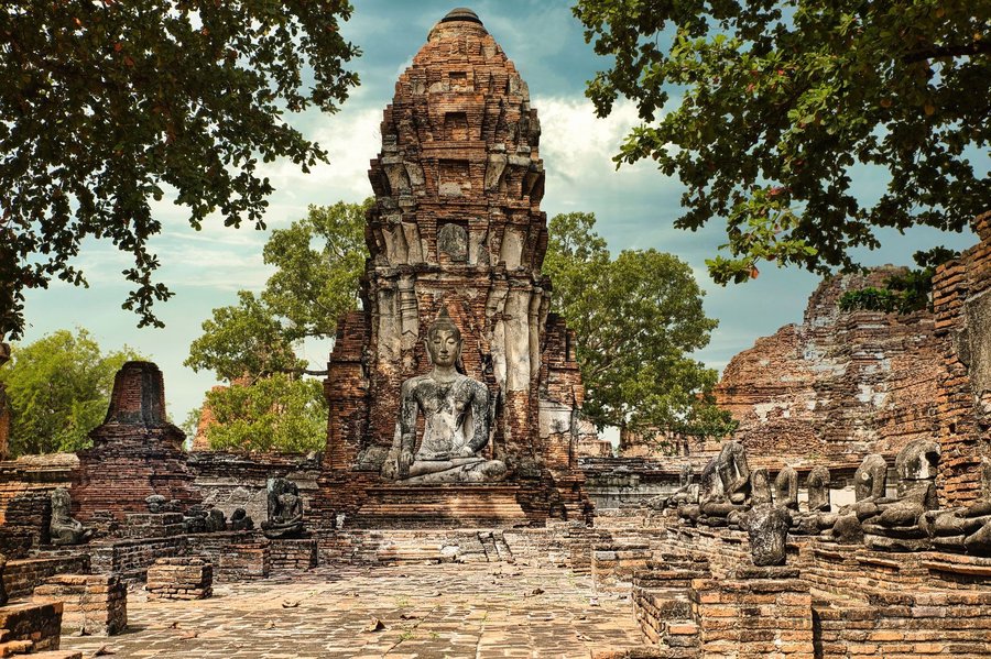 Weathered Buddha statue within the ruins of Ayutthaya