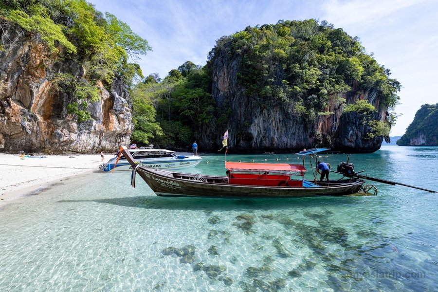Quiet cove with a long-tail boat on a Thai island